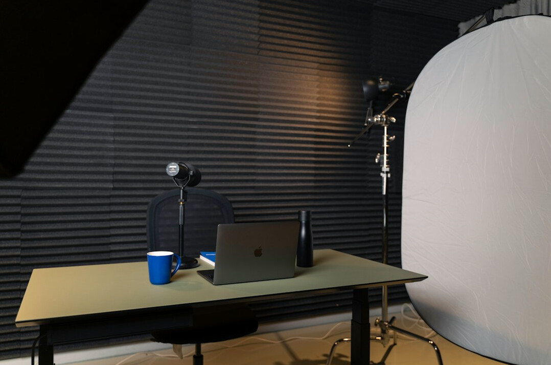 Empty television studio set with anchor desk and lights